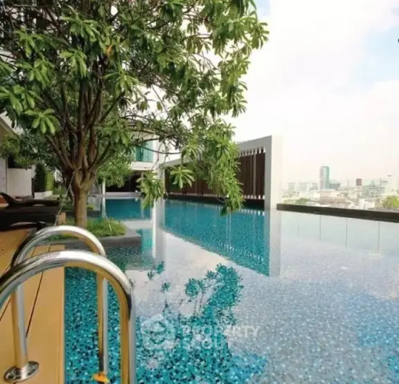 Luxurious rooftop pool with stunning city views and lush greenery.