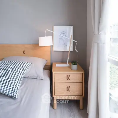 Modern bedroom with stylish wooden furniture and natural light