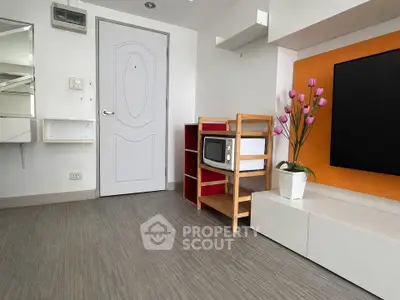 Modern living room with stylish decor and vibrant accents