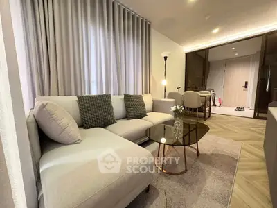 Modern living room with stylish decor and cozy seating area in a contemporary apartment.