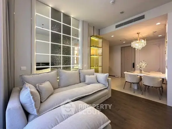Luxurious modern living room with elegant dining area and plush seating, perfect for sophisticated urban living.