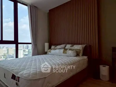 Modern bedroom with city view and stylish wooden paneling