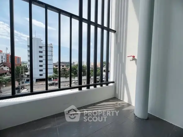 Modern balcony with city view and sleek railing design