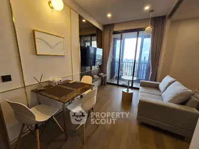 Modern living room with stylish decor and balcony view in urban apartment