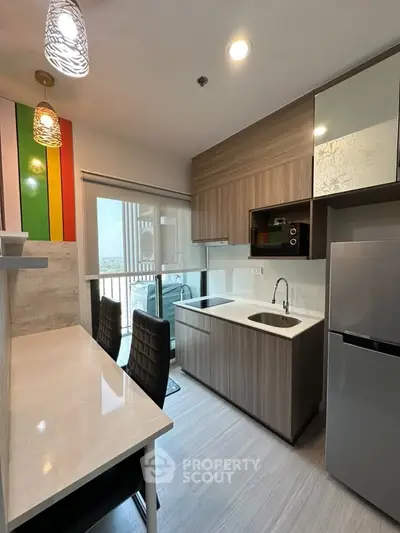 Modern kitchen with sleek cabinets and breakfast bar in a stylish apartment