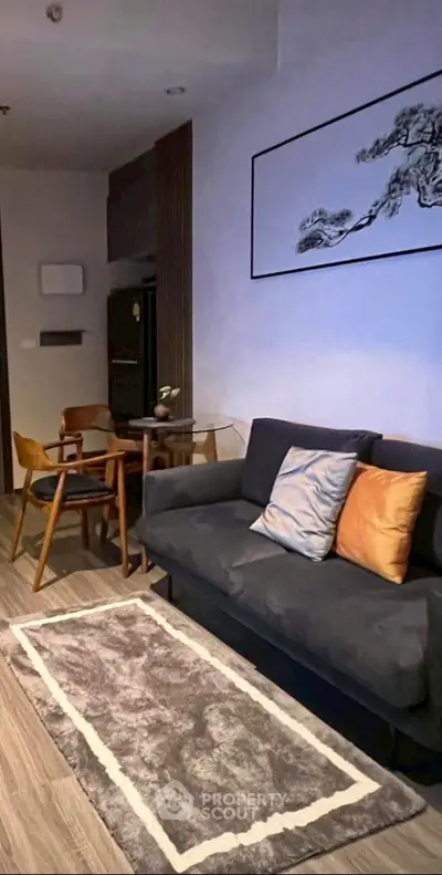 Modern living room with stylish decor and cozy seating area in a contemporary apartment.
