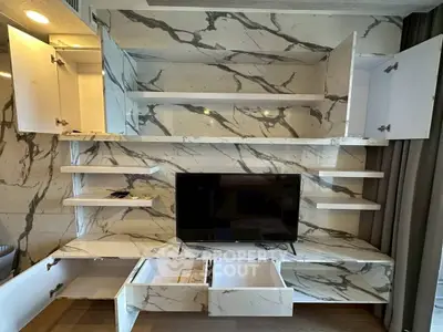 Modern living room with marble accent wall and built-in TV unit