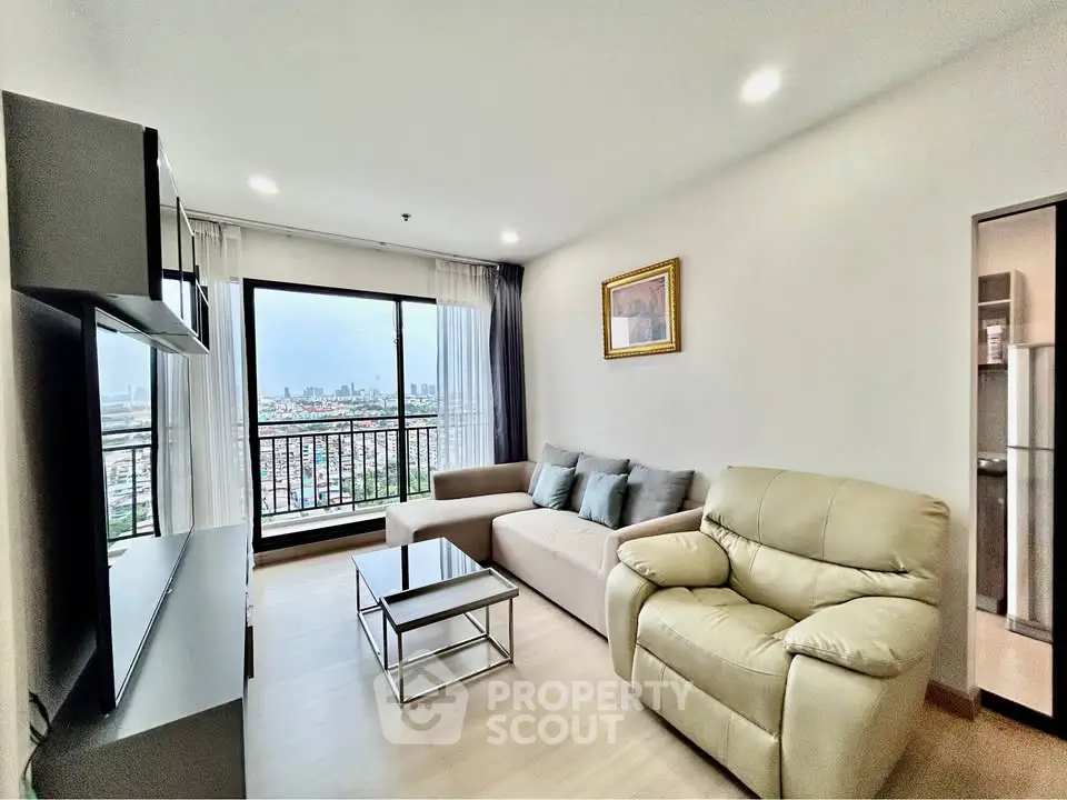 Modern living room with city view, featuring cozy seating and stylish decor in a high-rise apartment.