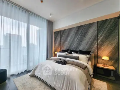 Luxurious modern bedroom with floor-to-ceiling windows and elegant decor