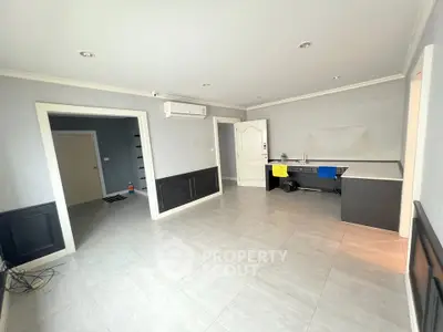 Spacious unfurnished room with modern tile flooring and air conditioning