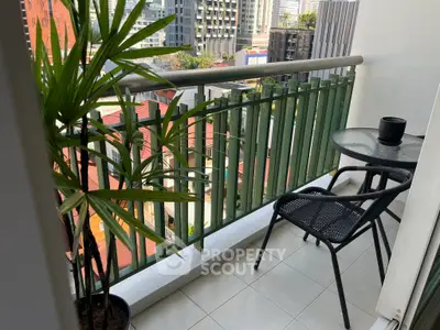 Charming urban balcony with city view, perfect for relaxation and enjoying the skyline.