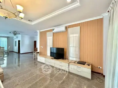 Spacious living room with modern decor and sleek flooring