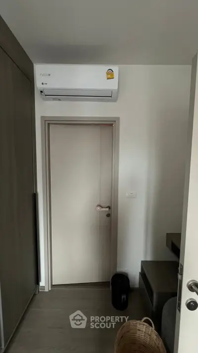 Modern interior with air conditioning and sleek door design.