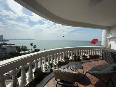 Stunning ocean view from spacious balcony with elegant seating area