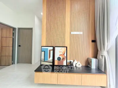 Modern living room with stylish wooden paneling and elegant decor