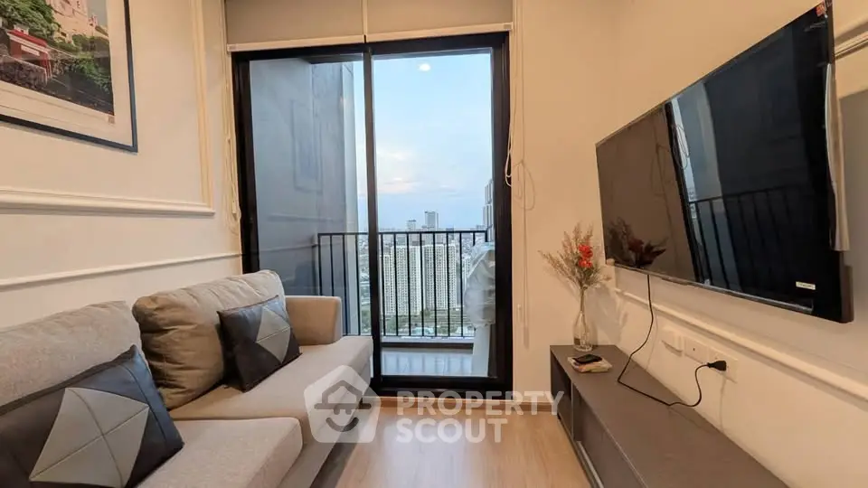 Modern living room with balcony view in high-rise apartment