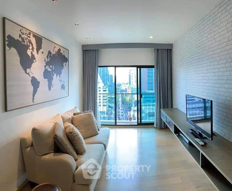 Modern living room with city view, stylish decor, and large world map artwork.