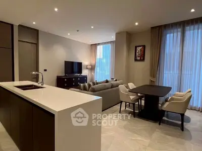 Modern open-plan living room with sleek kitchen and elegant dining area