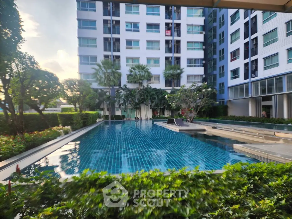 Luxurious condominium with stunning pool and lush greenery