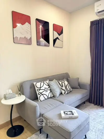 Cozy living room with modern decor and stylish artwork, perfect for relaxation and entertaining.