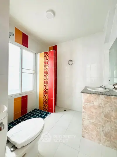 Bright bathroom with colorful tiles and modern fixtures