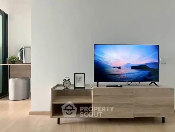 Modern living room with sleek TV stand and scenic view on screen
