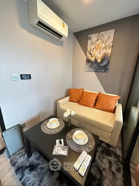 Cozy living room with modern decor and air conditioning