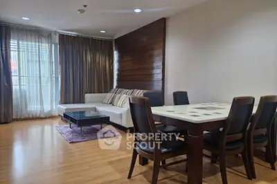 Spacious living room with elegant dining area and modern furniture