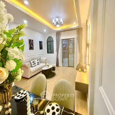 Elegant living room with modern decor and stylish dining area