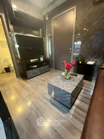 Modern living room with sleek marble accents and stylish decor