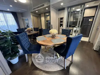 Elegant dining area with stylish chairs and wooden table in modern apartment