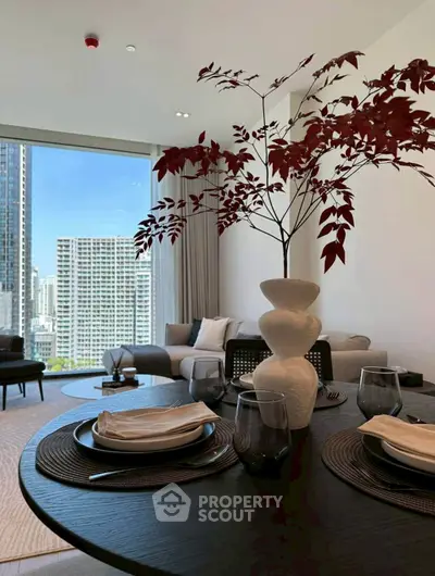 Elegant living room with modern decor and stunning city view, perfect for urban living.