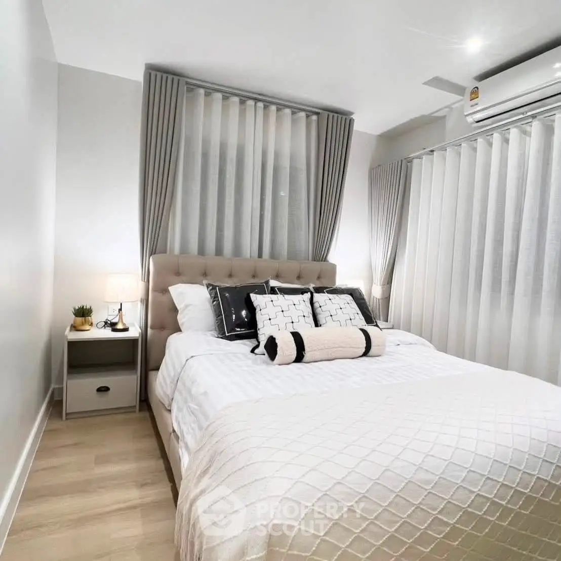Cozy modern bedroom with elegant decor and natural light