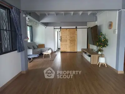 Spacious living room with wooden flooring and modern decor