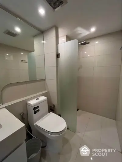 Modern bathroom with sleek design and glass shower partition