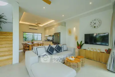 Spacious modern living room with open kitchen and stylish decor