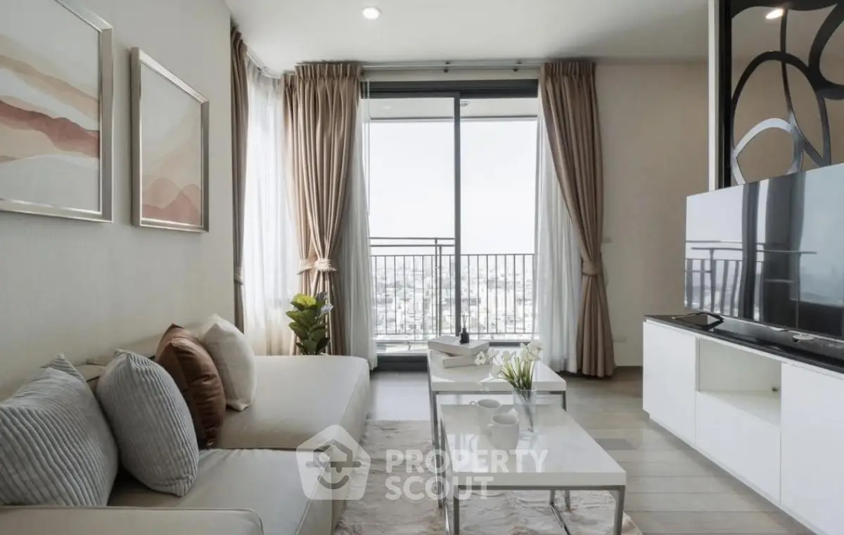 Modern living room with balcony view, stylish decor, and natural light