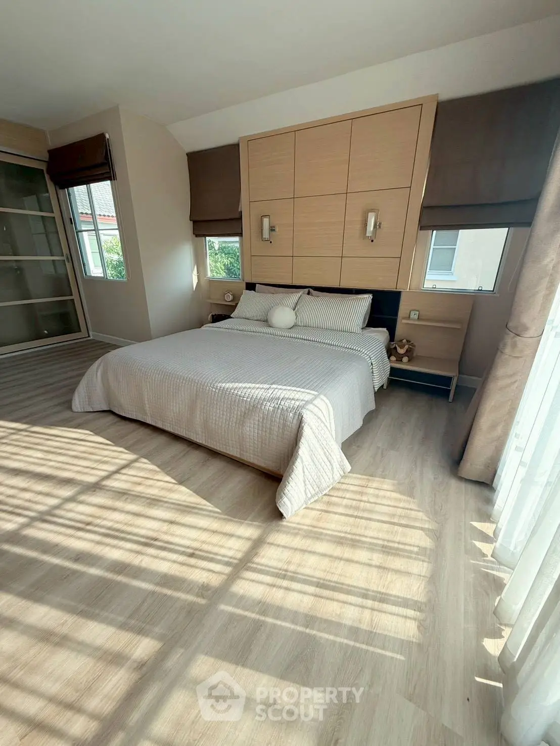Spacious bedroom with modern design and ample natural light