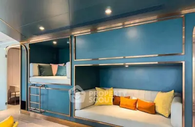 Stylish modern living room with built-in bunk beds and vibrant cushions