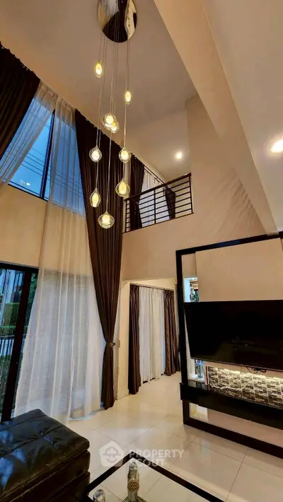 Luxurious modern living room with high ceilings and elegant lighting