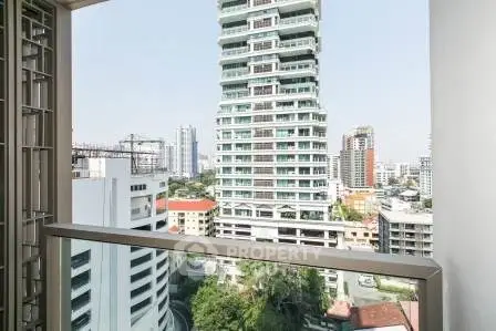 Stunning cityscape view from a high-rise balcony, showcasing modern architecture and urban living.