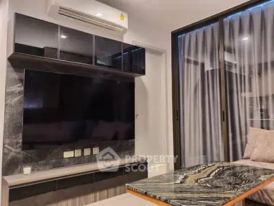 Modern living room with sleek TV setup and stylish marble coffee table