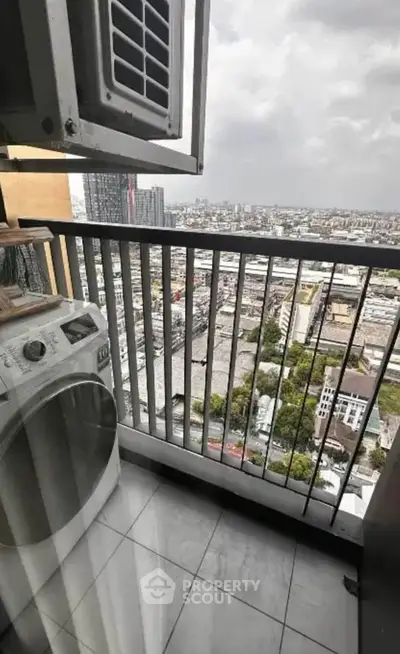 High-rise balcony with washing machine and stunning city view