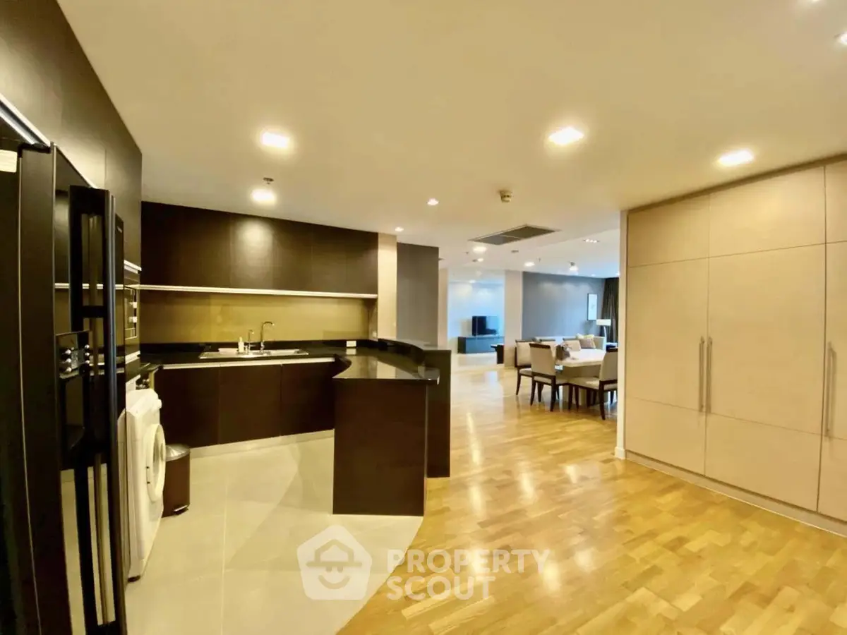 Spacious modern kitchen with open layout and sleek design in luxury apartment
