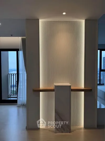 Modern interior with elegant lighting and balcony view