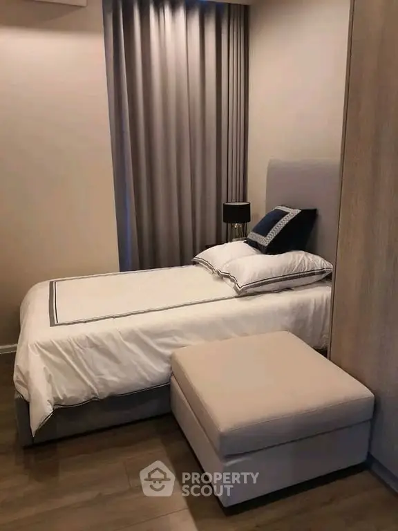 Cozy bedroom with elegant decor and soft lighting, perfect for relaxation.