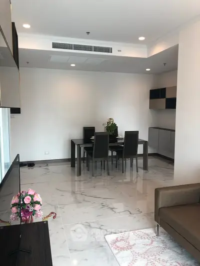 Modern living room with marble flooring and elegant dining area