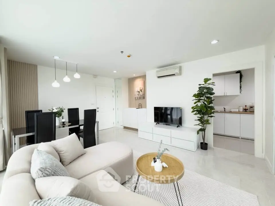 Spacious modern living room with open kitchen and elegant decor
