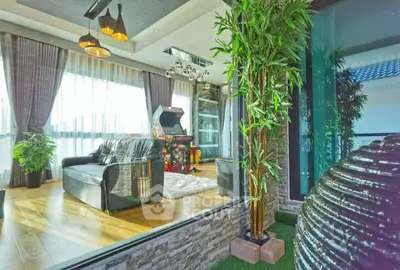 Luxurious living room with arcade game and modern decor