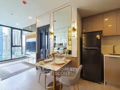 Modern open-plan living area with dining set and city view, featuring sleek kitchen and cozy decor.